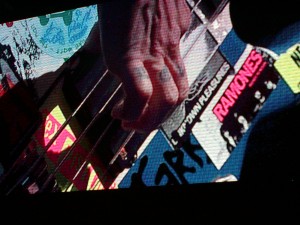 Close up Flea playing Punk Bass guitar